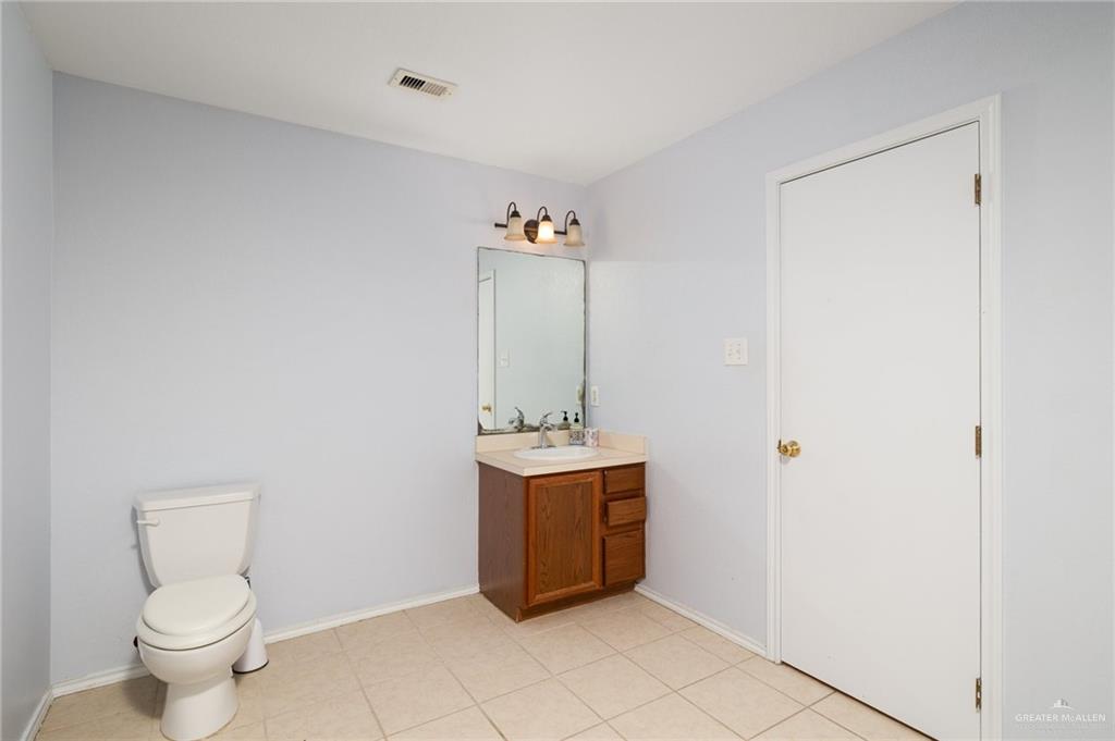 7105 North 40th Street McAllen, TX 78504 - Photo 9 of 13 a room with a toilet