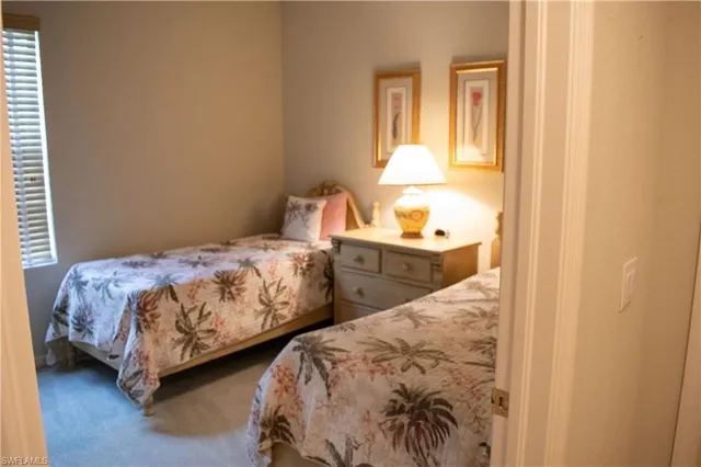 a bedroom with two beds and painted walls