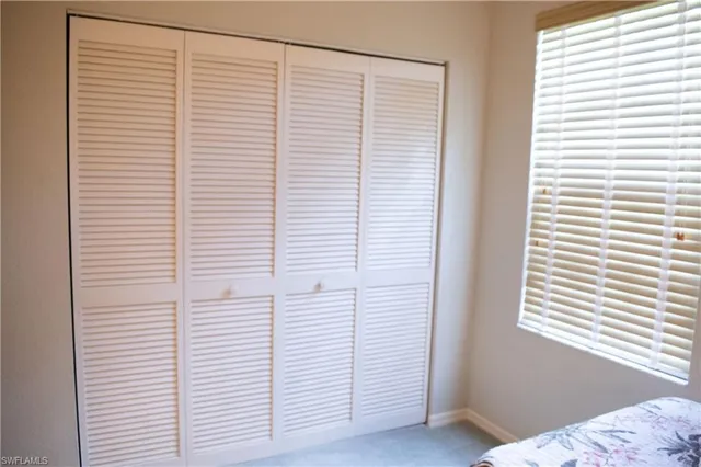 a view of a bedroom with a window