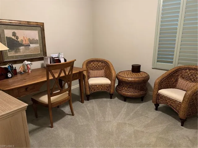 a bedroom with furniture and a window