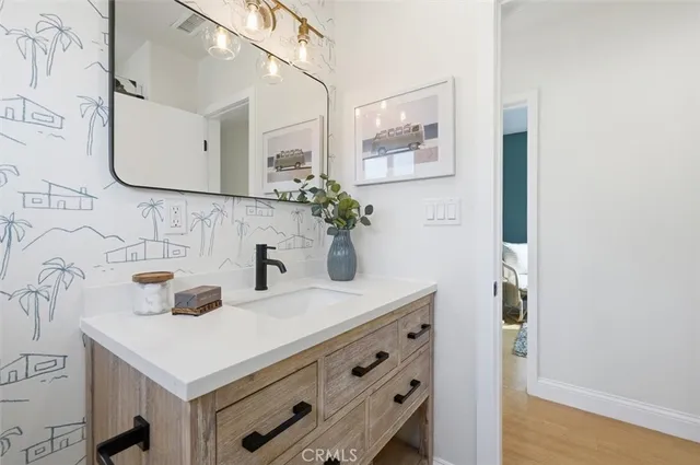 a bathroom with a sink and a mirror