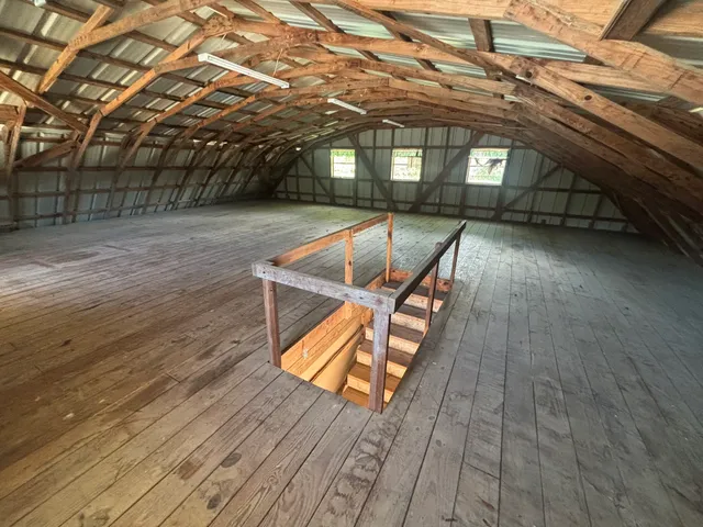 an outdoor space with wooden floor