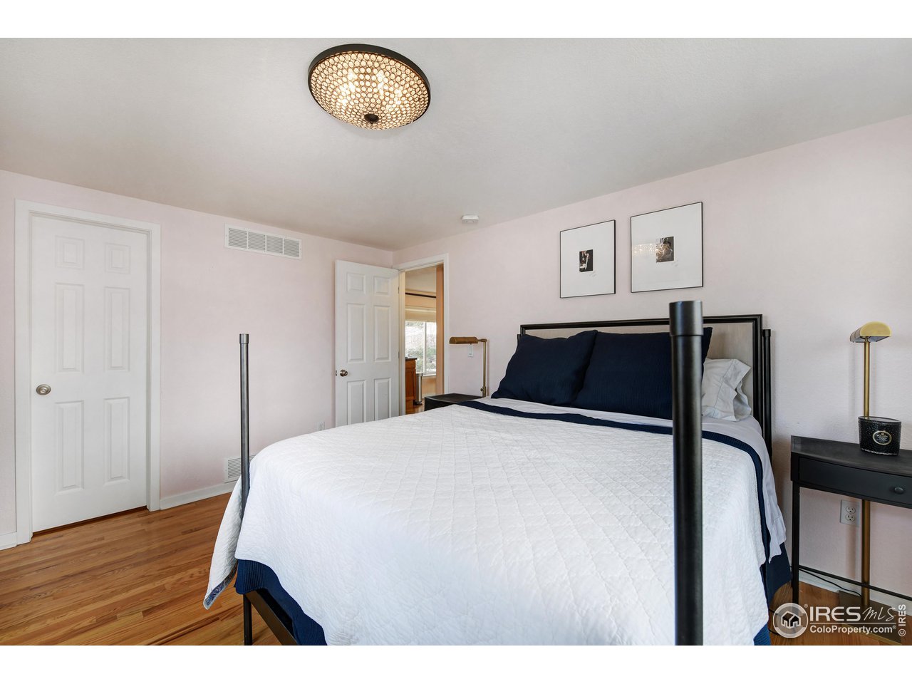 2701 Mapleton Avenue, Unit C Boulder, CO 80304 - Photo 16 of 34 a bedroom with a bed and a table