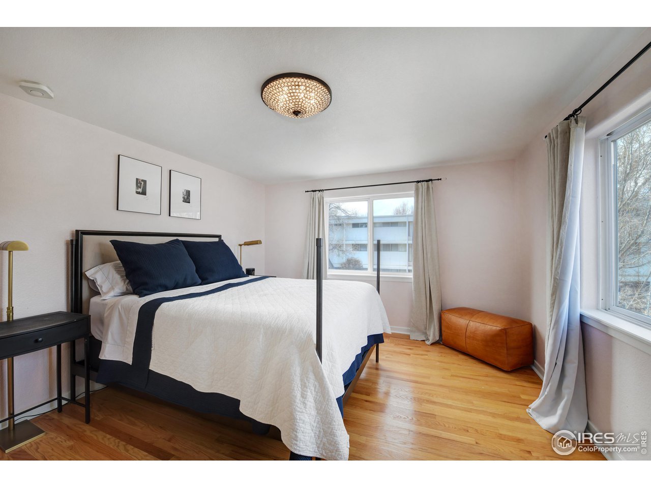 2701 Mapleton Avenue, Unit C Boulder, CO 80304 - Photo 17 of 34 a bedroom with a bed and window