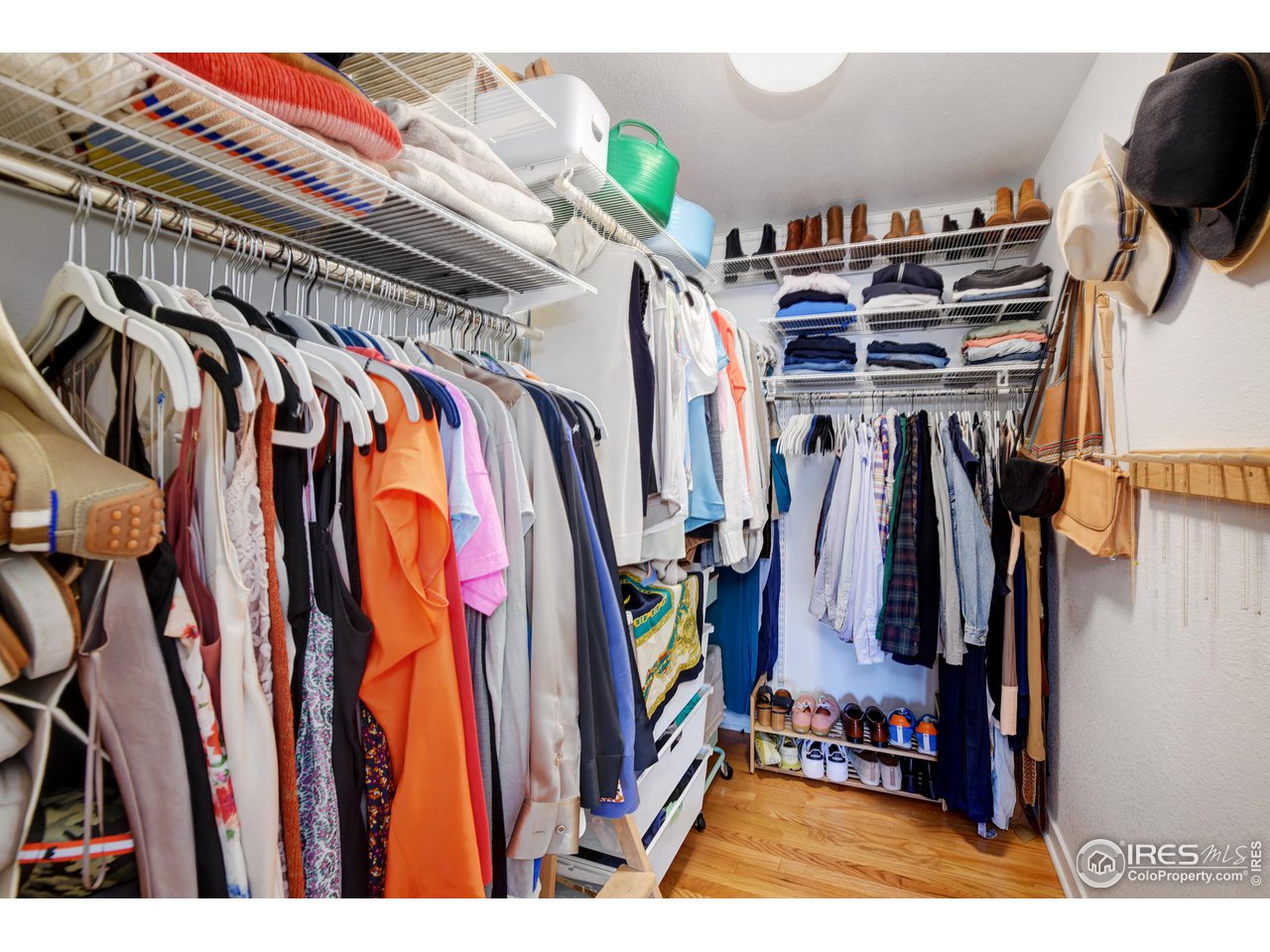 2701 Mapleton Avenue, Unit C Boulder, CO 80304 - Photo 19 of 34 a view of walk in closet with clothes and shoes