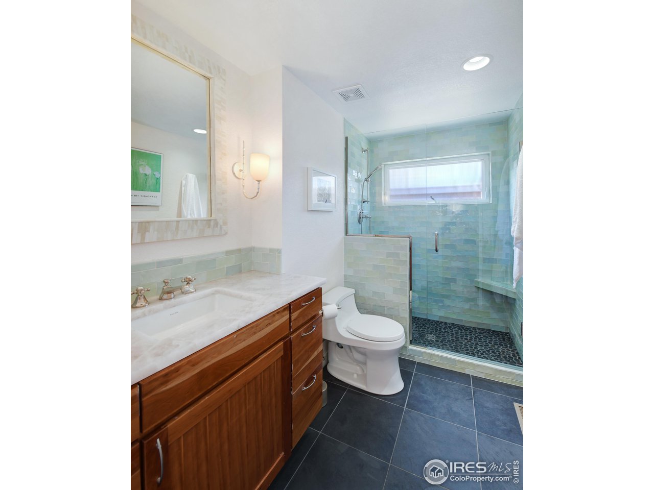 2701 Mapleton Avenue, Unit C Boulder, CO 80304 - Photo 20 of 34 a bathroom with a sink a toilet and shower