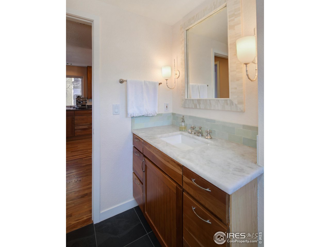 2701 Mapleton Avenue, Unit C Boulder, CO 80304 - Photo 22 of 34 a bathroom with a sink and a mirror