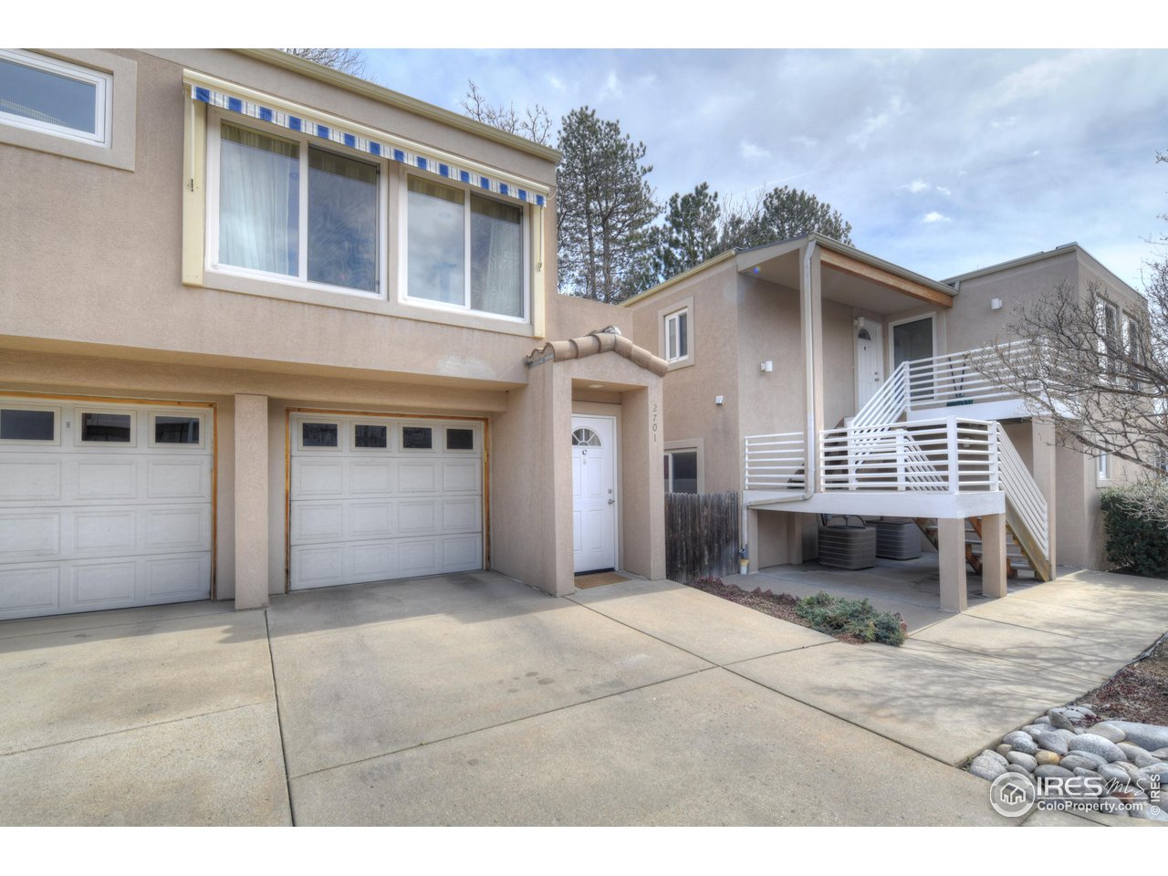 2701 Mapleton Avenue, Unit C Boulder, CO 80304 - Photo 26 of 34 a front view of a house with a garage