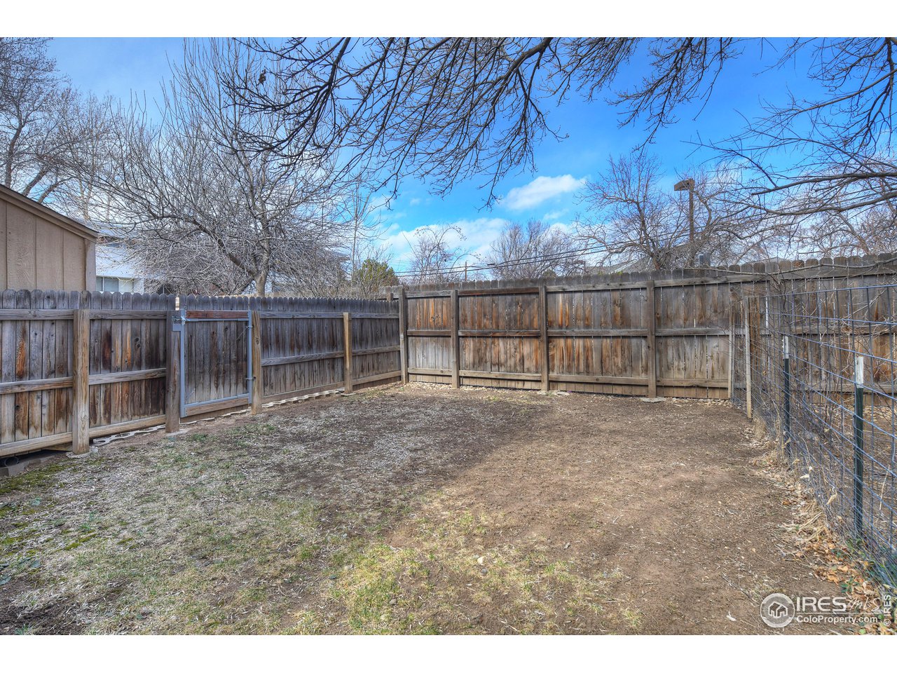 2701 Mapleton Avenue, Unit C Boulder, CO 80304 - Photo 33 of 34 a view of backyard with wooden fence