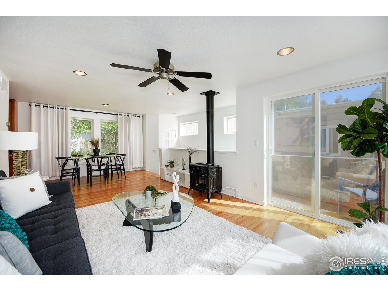 2701 Mapleton Avenue, Unit C Boulder, CO 80304 - Photo 4 of 34 a living room with furniture and a large window