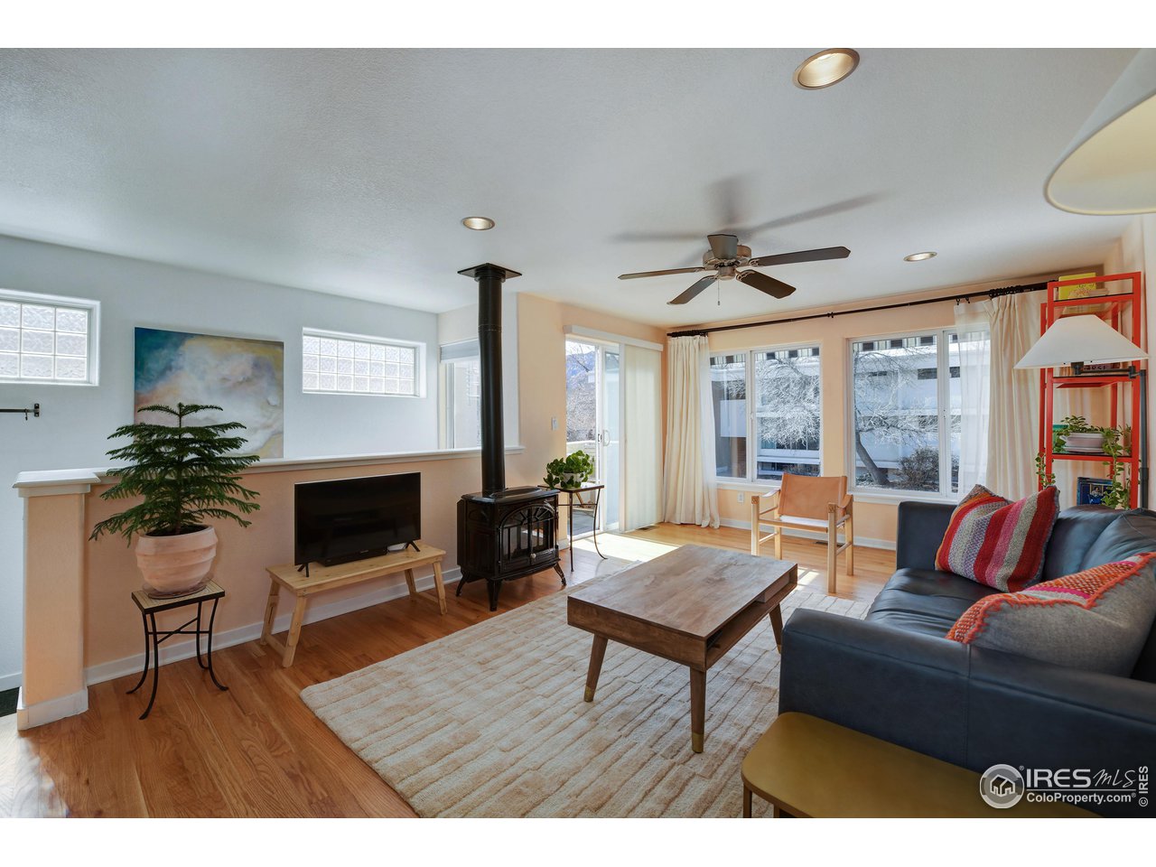 2701 Mapleton Avenue, Unit C Boulder, CO 80304 - Photo 5 of 34 a living room with furniture and a fireplace