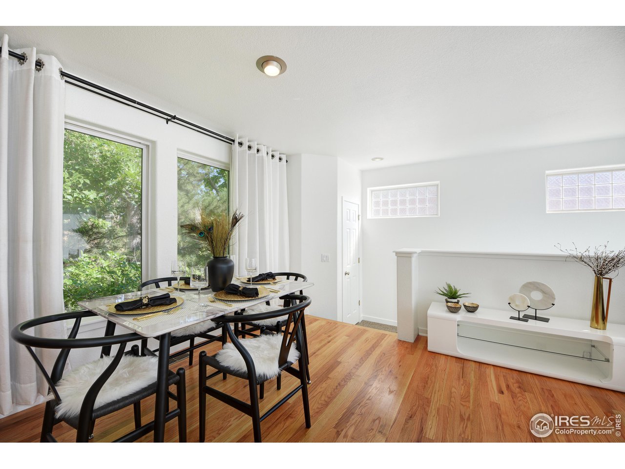 2701 Mapleton Avenue, Unit C Boulder, CO 80304 - Photo 8 of 34 a view of a dining room with furniture and wooden floor
