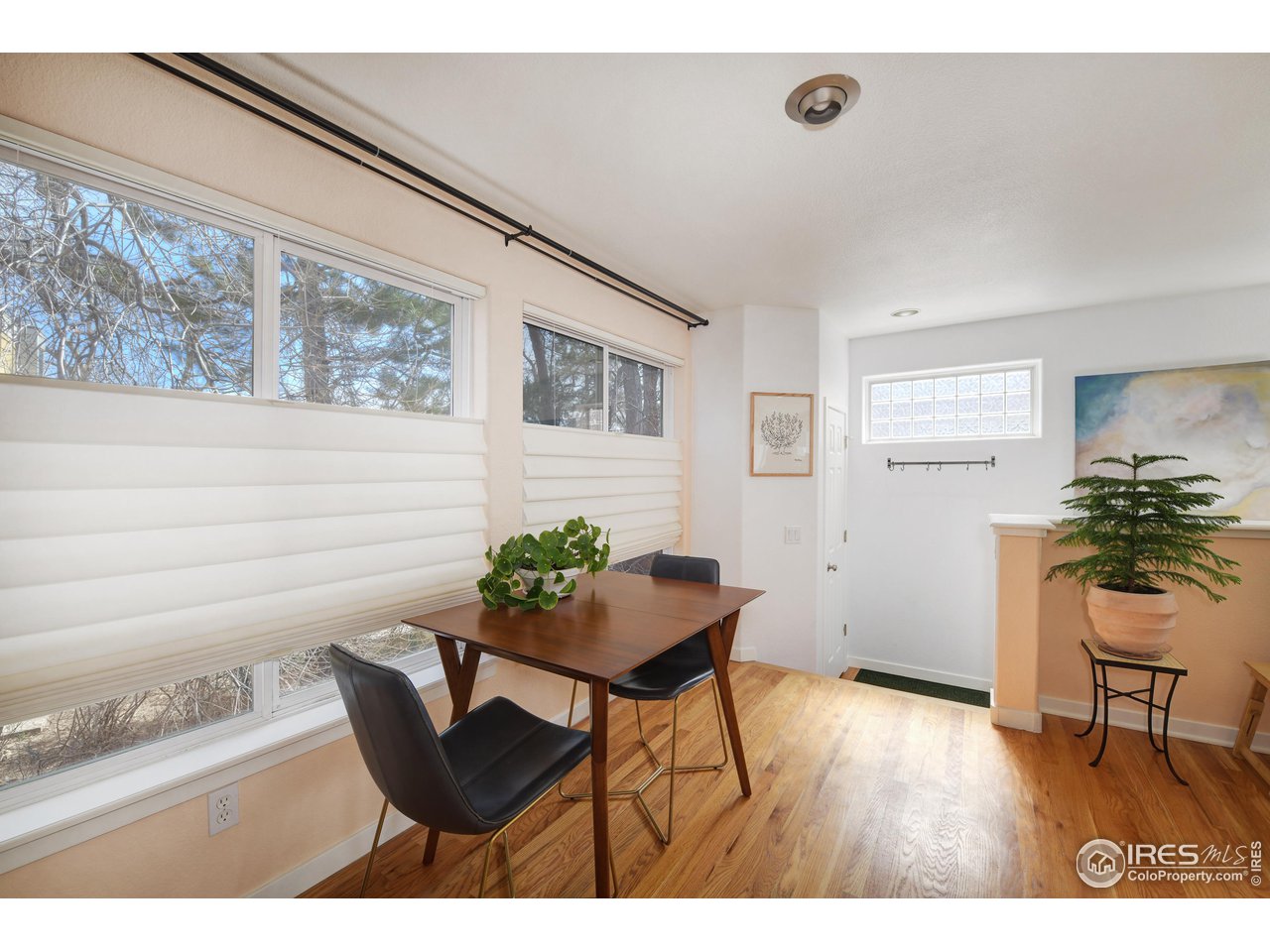 2701 Mapleton Avenue, Unit C Boulder, CO 80304 - Photo 10 of 34 a room with furniture and wooden floor