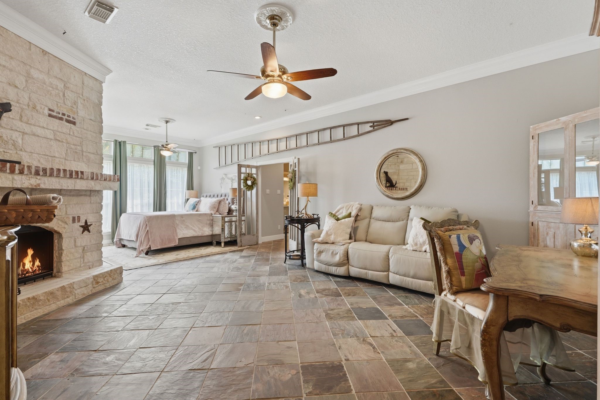 25014 Northampton Terrace Drive Spring, TX 77389 - Photo 18 of 41 The spacious primary bedroom is located on the first floor and provides a serene atmosphere w/fireplace and expansive seating area