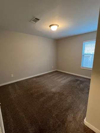 en empty room with windows
