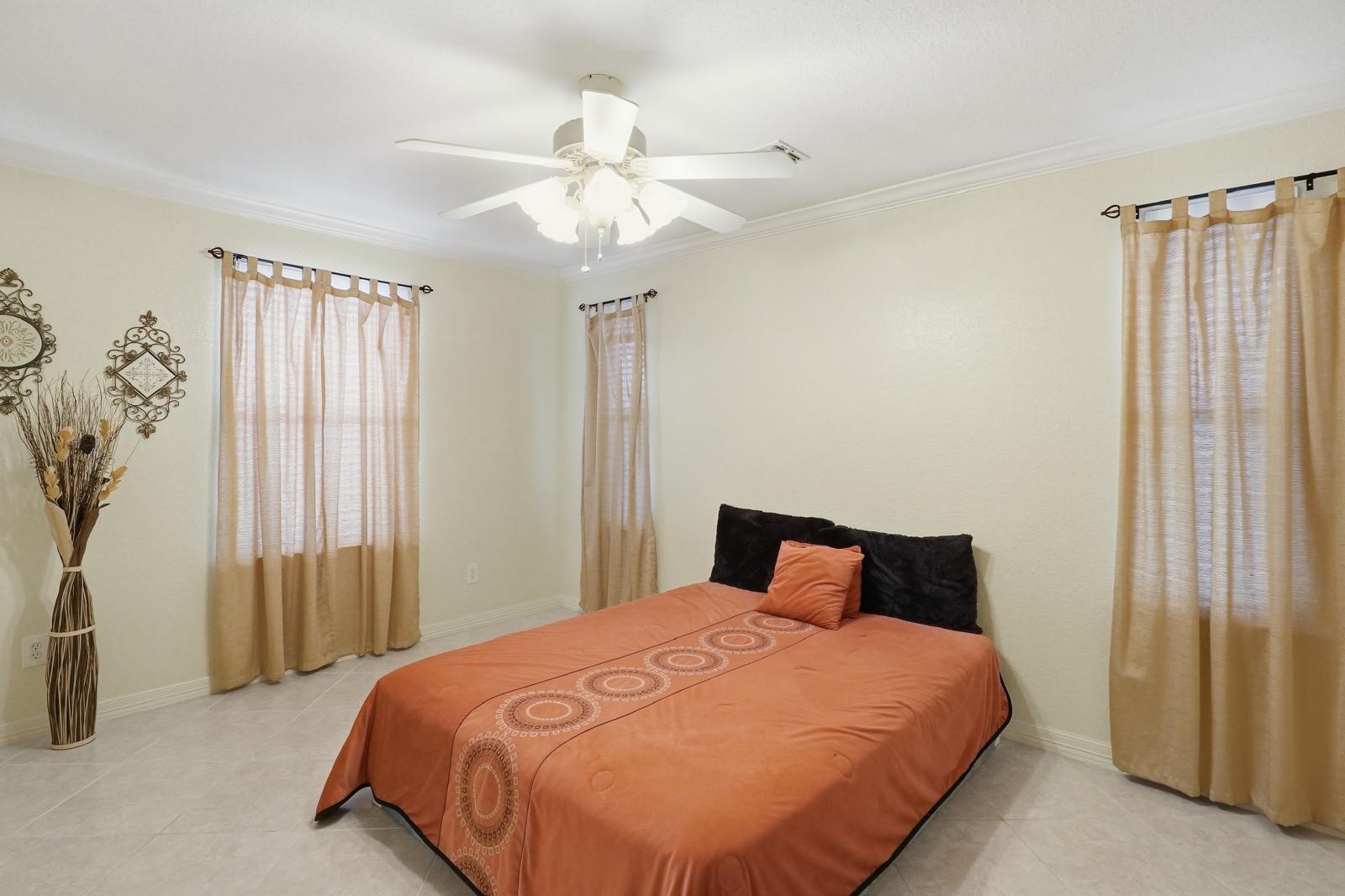 247 Old Spring Lane Houston, TX 77015 - Photo 20 of 25 a bedroom with a large bed and a chandelier