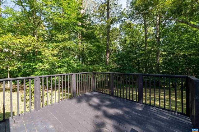 a backyard of a house with lots of green space and fountain