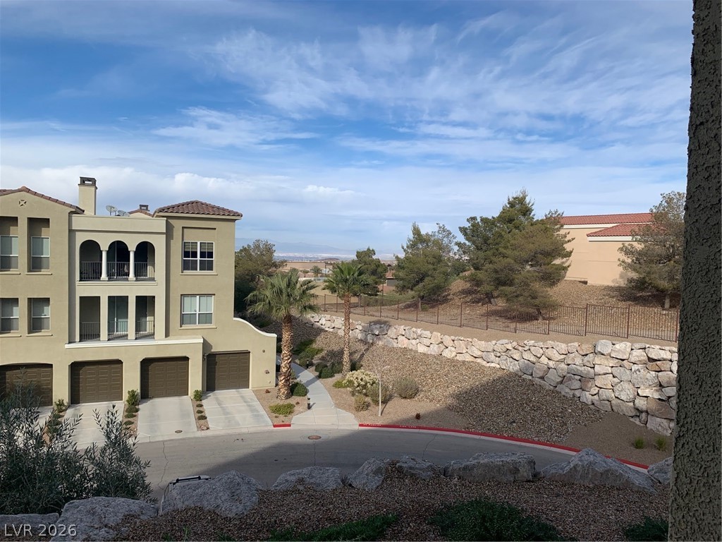 2555 Hampton Road, Unit 7109 Henderson, NV 89052 - Photo 16 of 34 Mediterranean-inspired architecture graces this multi-story building, offering views of distant natural landscapes.