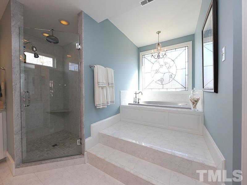 8808 Ross Court Raleigh, NC 27613 - Photo 11 of 25 a bathroom with a bathtub and a shower