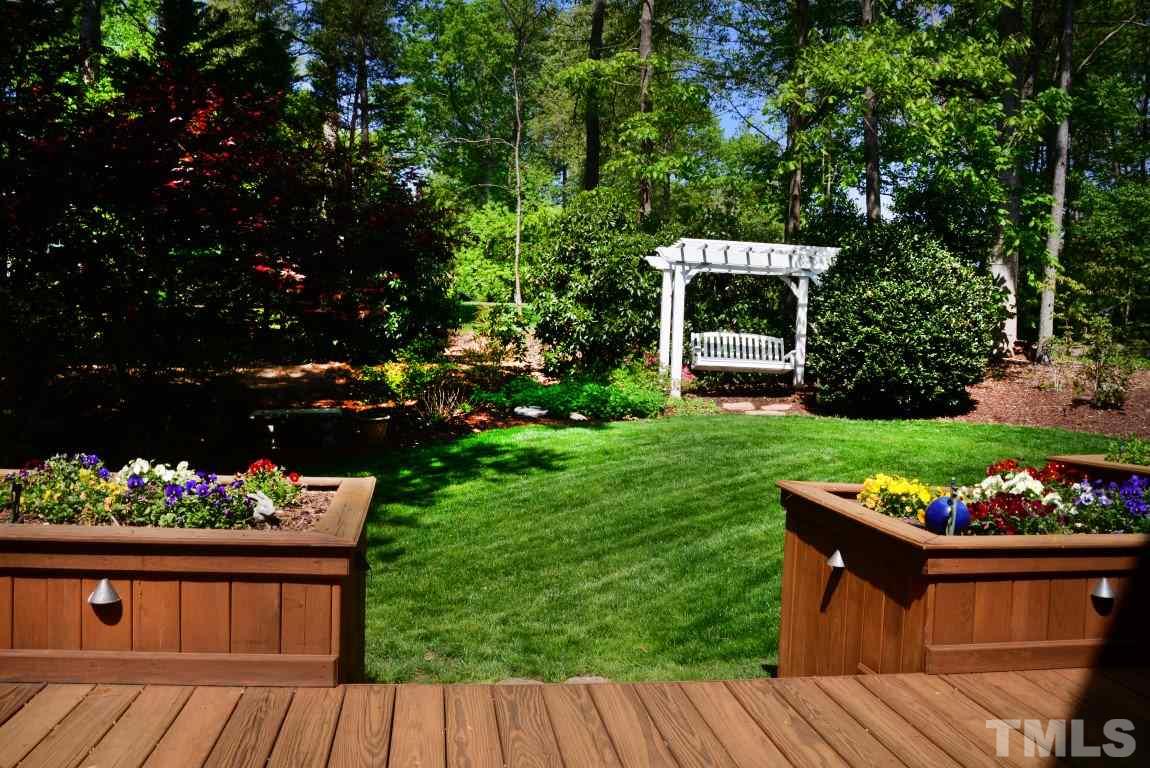 8808 Ross Court Raleigh, NC 27613 - Photo 18 of 25 a view of house with backyard space and garden
