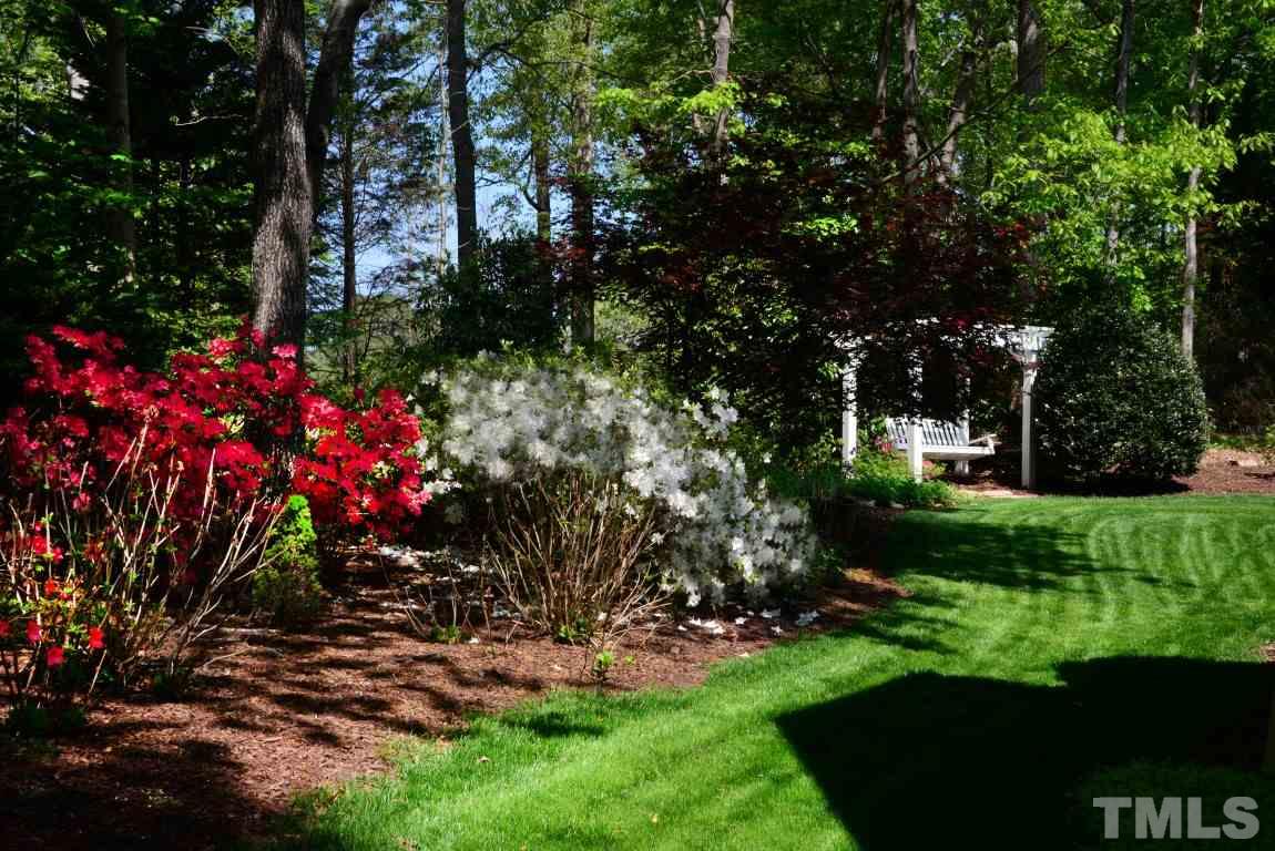 8808 Ross Court Raleigh, NC 27613 - Photo 23 of 25 a view of a garden with flowers