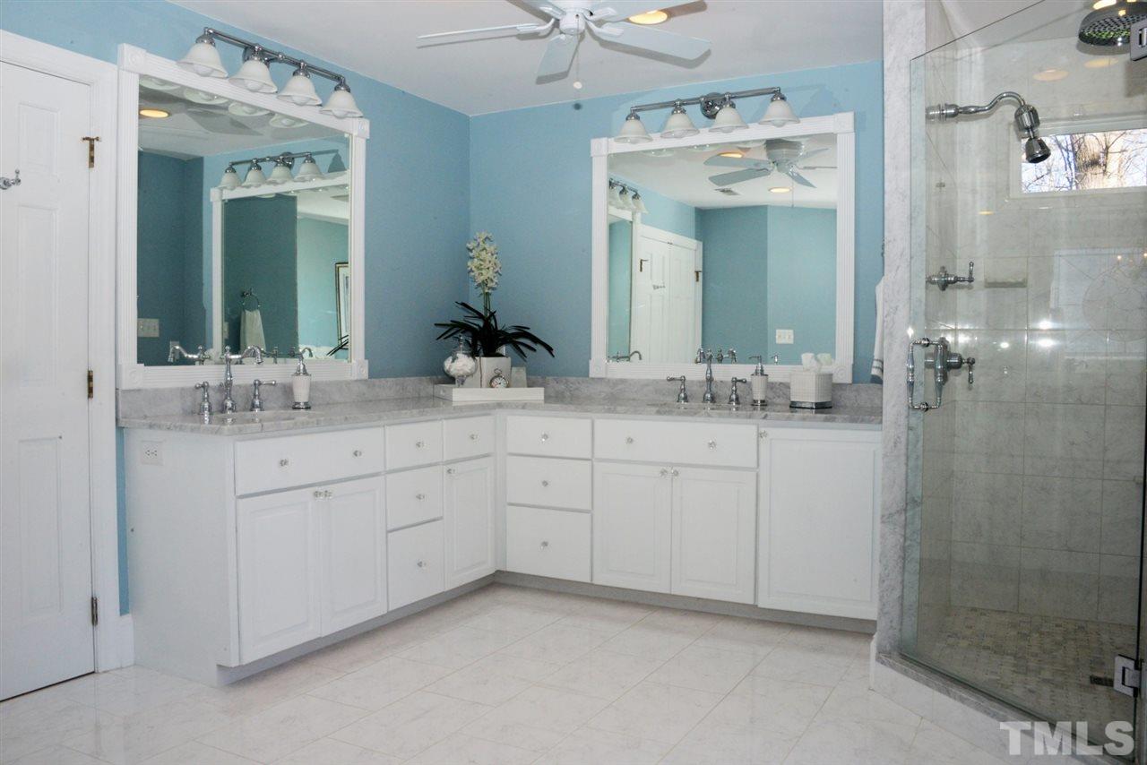 8808 Ross Court Raleigh, NC 27613 - Photo 4 of 25 a bathroom with a sink and a mirror