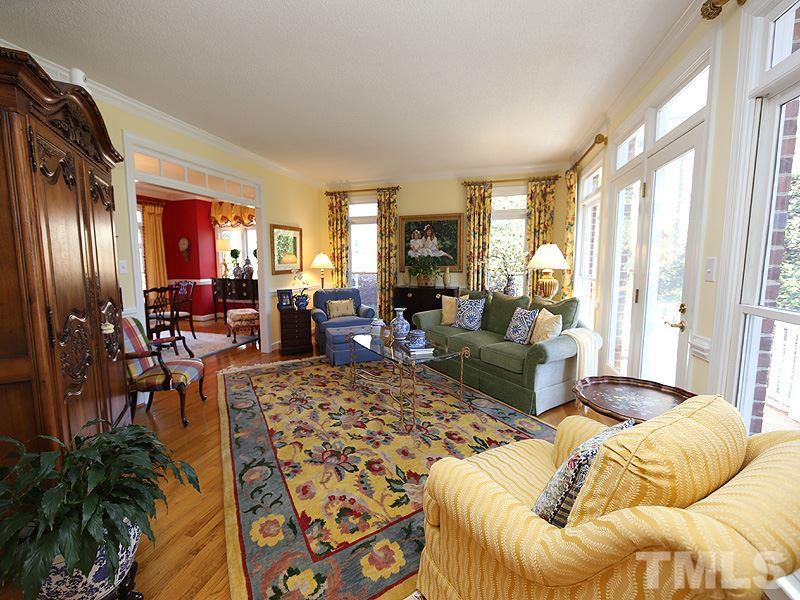 8808 Ross Court Raleigh, NC 27613 - Photo 8 of 25 a living room with furniture fireplace and a large window