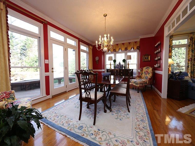 8808 Ross Court Raleigh, NC 27613 - Photo 9 of 25 a view of a dining room with furniture window and wooden floor