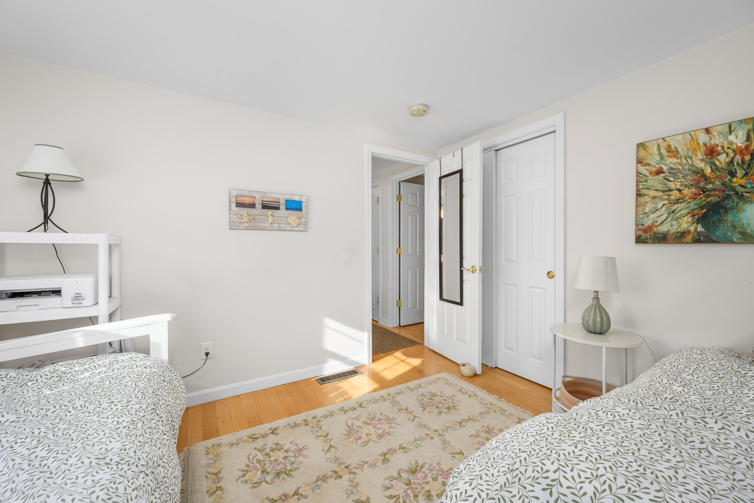 5 Chickadee Lane Centerville, MA 02632 - Photo 17 of 22 a bedroom with a bed and a lamp