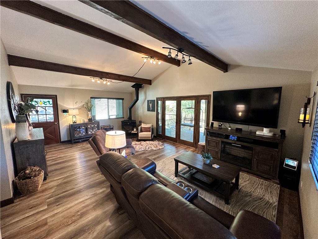 6615 Flag Mine Road Kingman, AZ 86401 - Photo 15 of 72 a living room with furniture and a flat screen tv