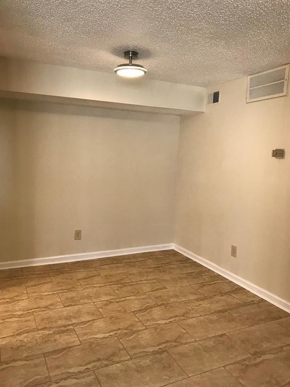 1947 Greenbriar Colony Drive, Unit 15518E Houston, TX 77032 - Photo 10 of 12 a view of an empty room