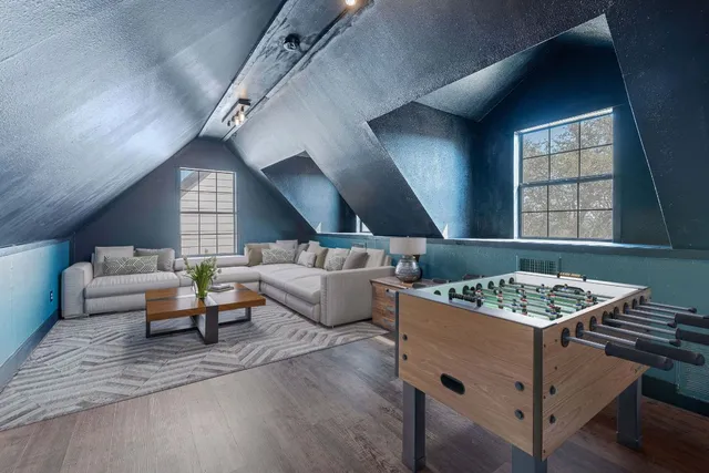 a living room with furniture and windows