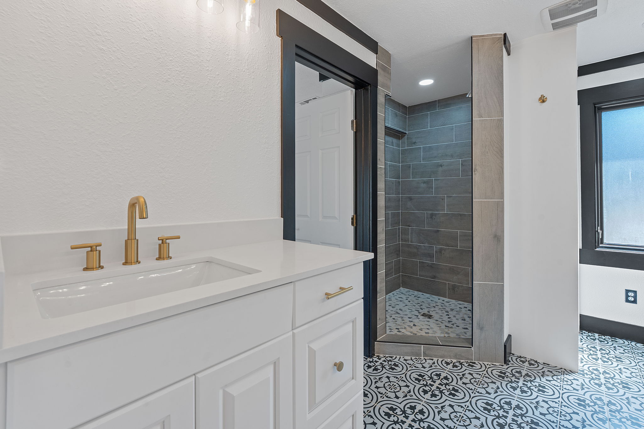 404 County Road 421 Spicewood, TX 78669 - Photo 16 of 31 a bathroom with a sink a toilet and shower