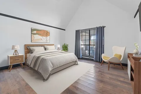 a view of a room with wooden floor and window