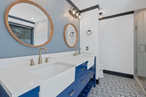 a bathroom with a bathtub and a window