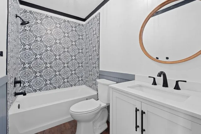 a bathroom with a sink a toilet and a bathtub