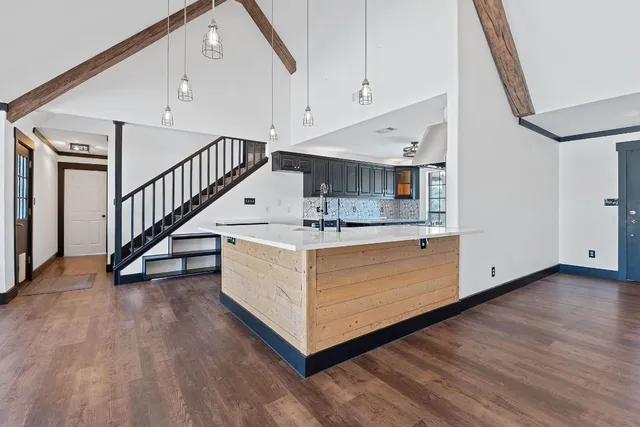 a view of an entryway with wooden floor
