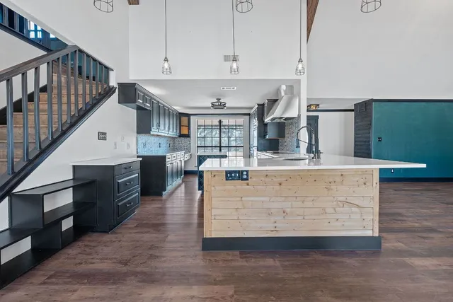 a view of kitchen with cabinets and wooden floor