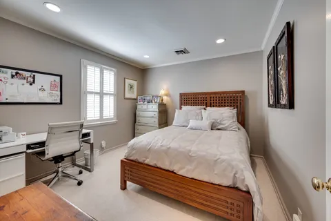 a view of a patio with table and chairs potted plants and wooden fence