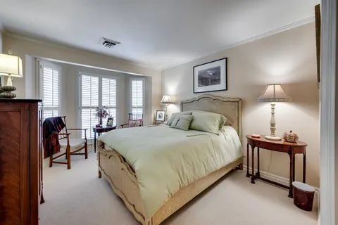 a view of a patio with table and chairs and potted plants