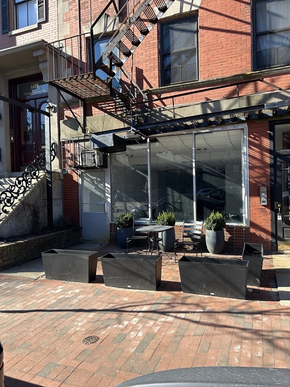 605 Massachusetts Avenue, Unit A Boston, MA 02118 - Photo 1 of 4 a view of a building with sitting area