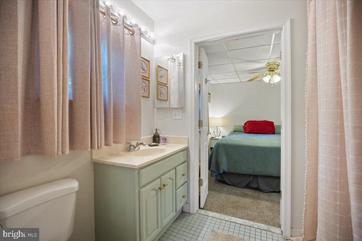 3330 1st Street Port Republic, MD 20676 - Photo 14 of 20 a bathroom with a sink toilet and shower