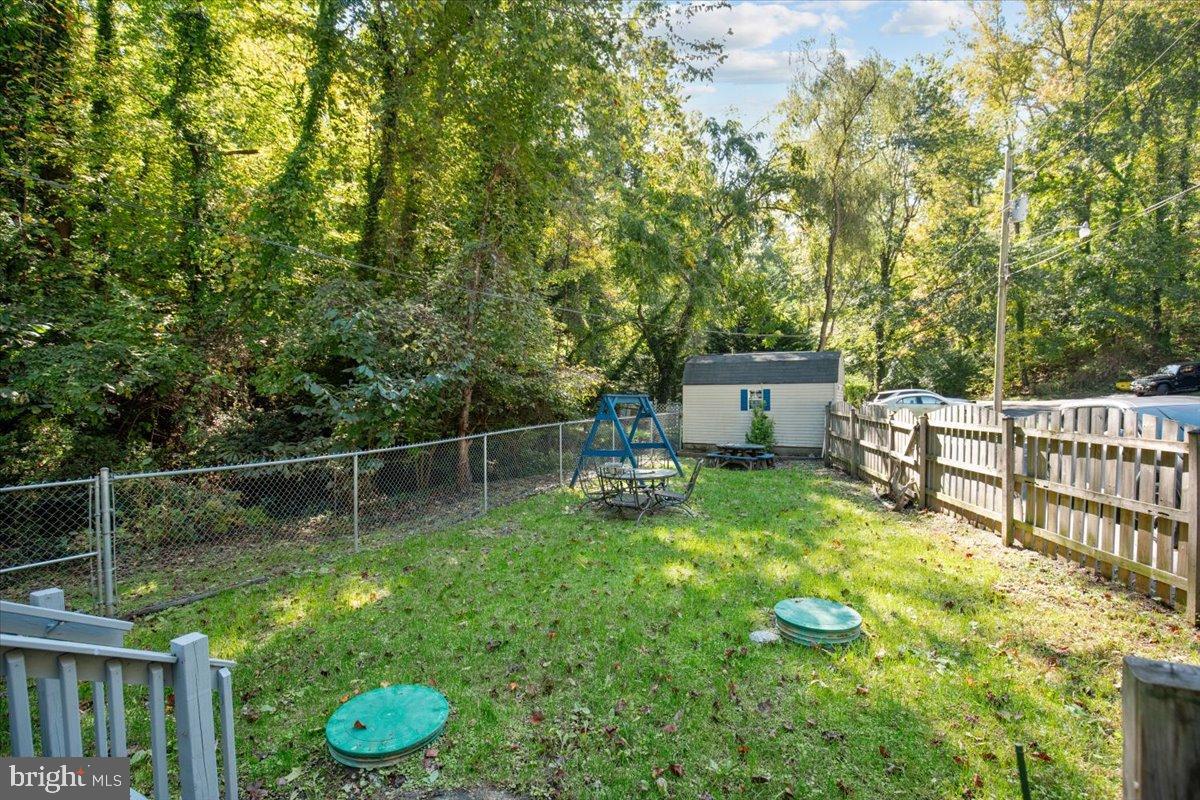 3330 1st Street Port Republic, MD 20676 - Photo 17 of 20 a backyard of a house with wooden floor and fence