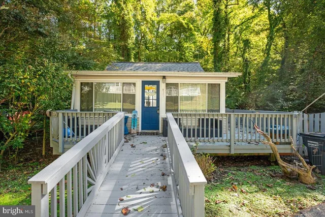a view of a deck with a fence and a yard