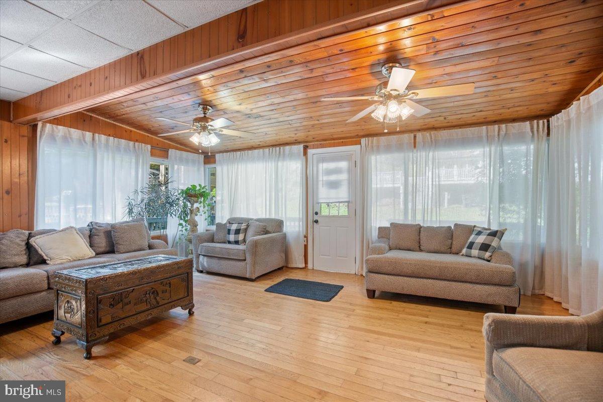 3330 1st Street Port Republic, MD 20676 - Photo 6 of 20 a living room with furniture and a large window