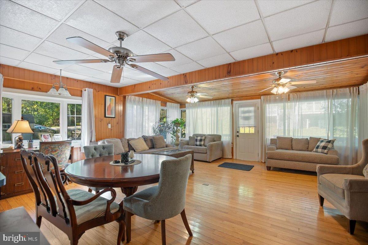 3330 1st Street Port Republic, MD 20676 - Photo 7 of 20 a dining room with furniture window and wooden floor