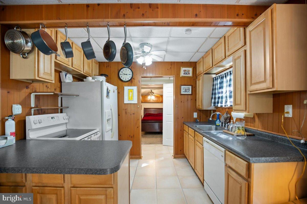 3330 1st Street Port Republic, MD 20676 - Photo 9 of 20 a kitchen with stainless steel appliances granite countertop a sink and a cabinets