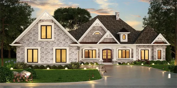 a front view of brick house with a yard