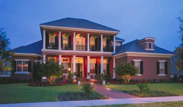a front view of a house with a garden