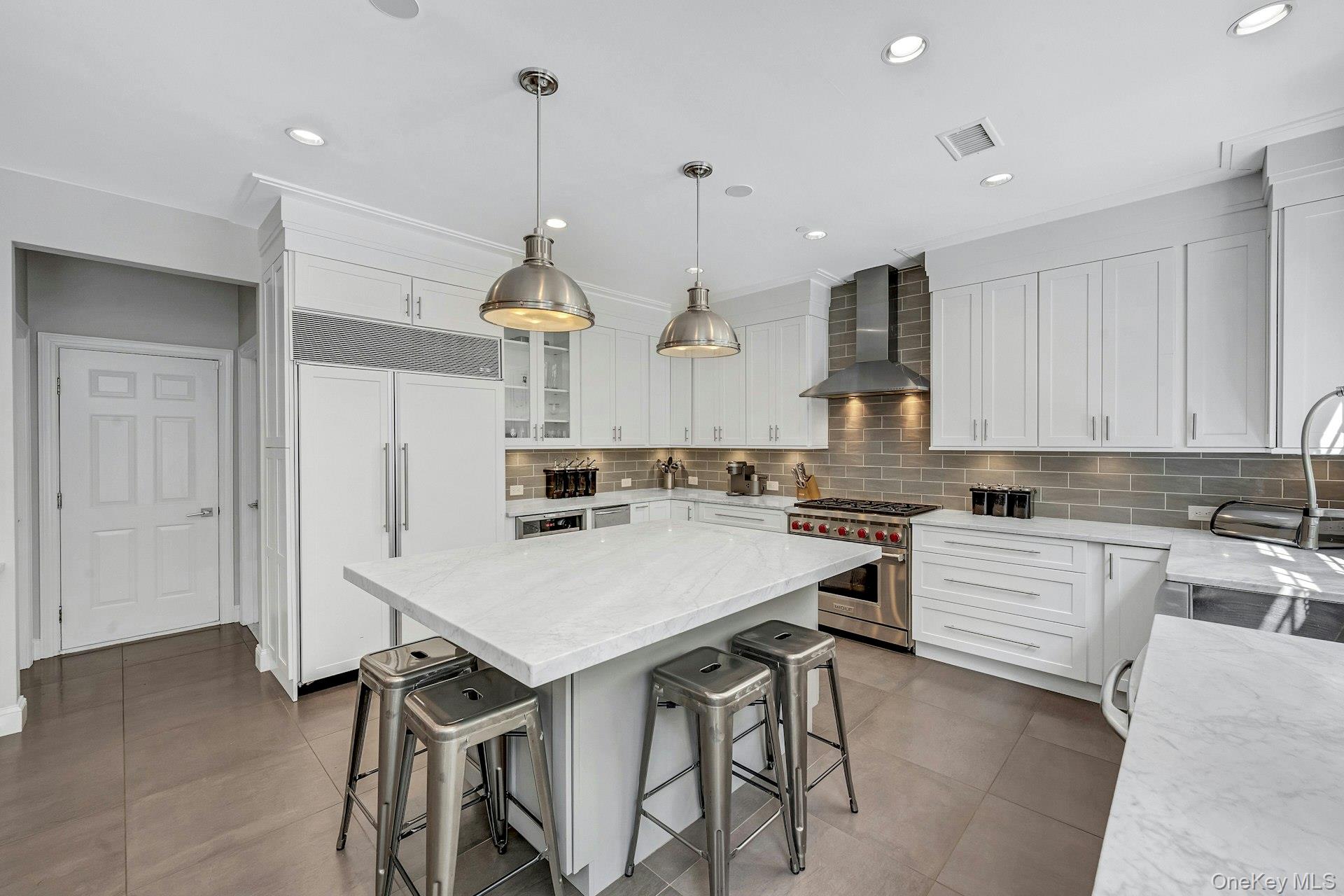 134 Euclid Avenue Ardsley, NY 10502 - Photo 14 of 48 Kitchen with stainless steel appliances, breakfast area, center island. Pantry and garage access.